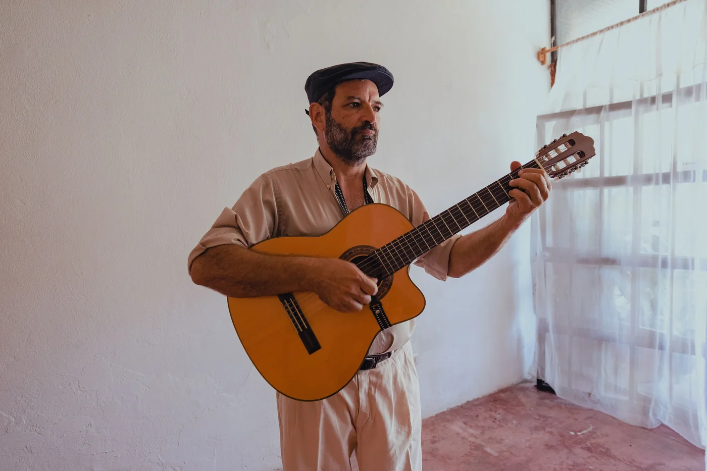 A flamenco guitarist playing on stage